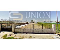 terreno con casa y nave en Montijo