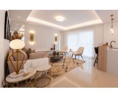Apartamentos de 2 o 3 dormitorios y villas adosadas con 2 baños que ofrecen jardín o solárium en la