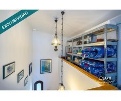 Casa de pescador con amarre