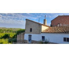 Casa con terreno en Mogón