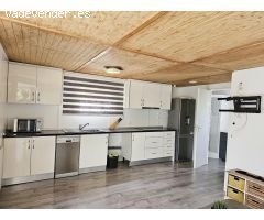 Dos casas de madera en una amplia parcela