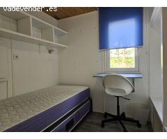 Dos casas de madera en una amplia parcela