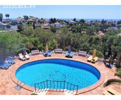 This beautiful villa is set in secluded gardens with its own huge, heated swimming pool surrounded b
