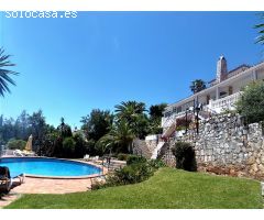 This beautiful villa is set in secluded gardens with its own huge, heated swimming pool surrounded b